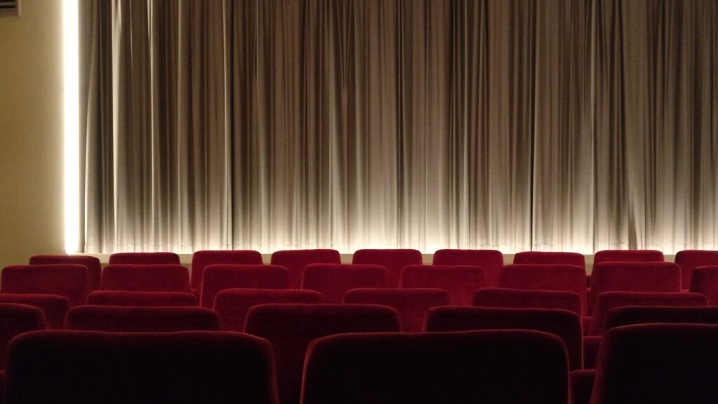 view of a theater stage from a seat