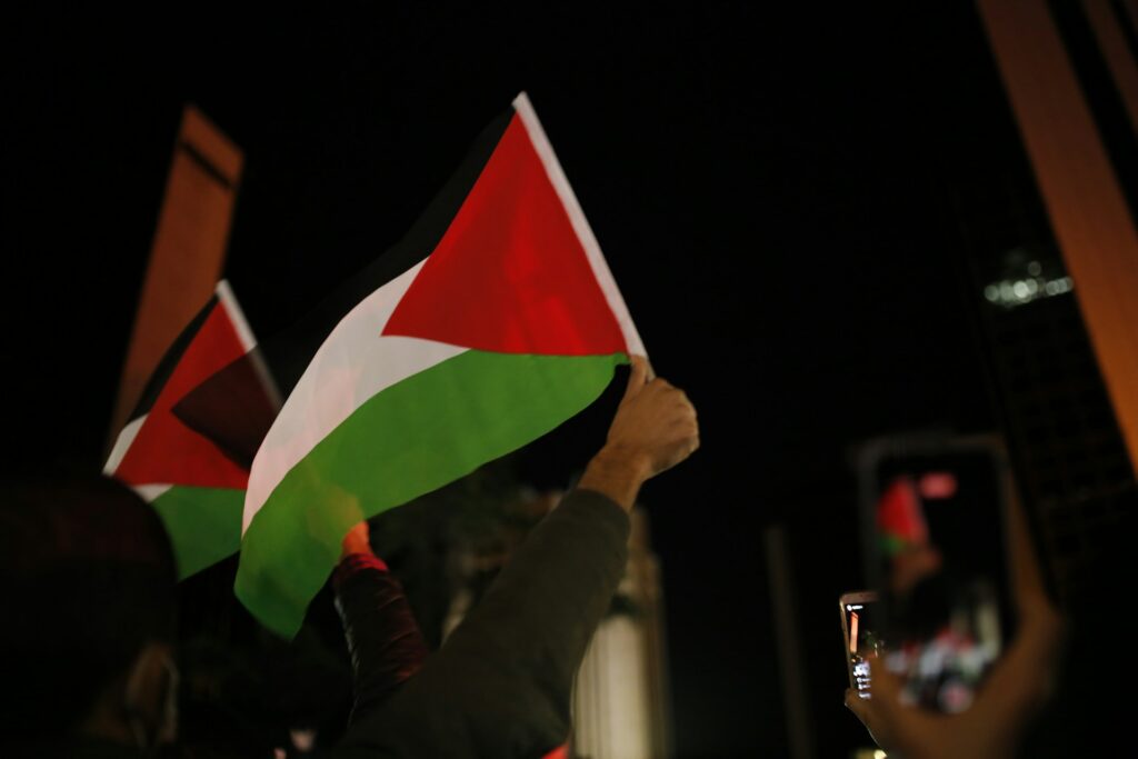 Flag of Palestine held up.
